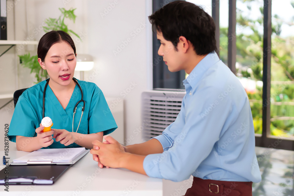 Fototapeta premium Doctor's Consultation: A doctor engages in a focused consultation with a patient, providing medication. The medical professionals discuss health.