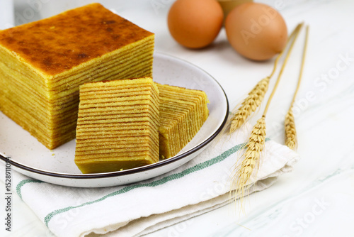Lapis Legit or Spekkoek, One of Indonesian traditional layered cake. Lapis legit especially served during celebration or special day. White marble background.