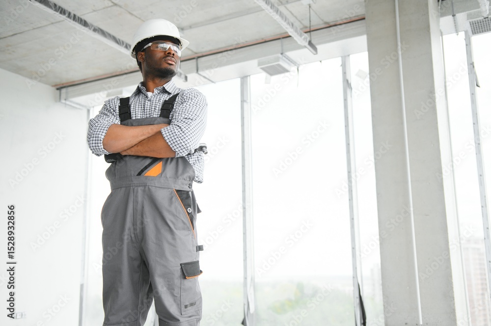 Fototapeta premium African american engineer at work on construction site