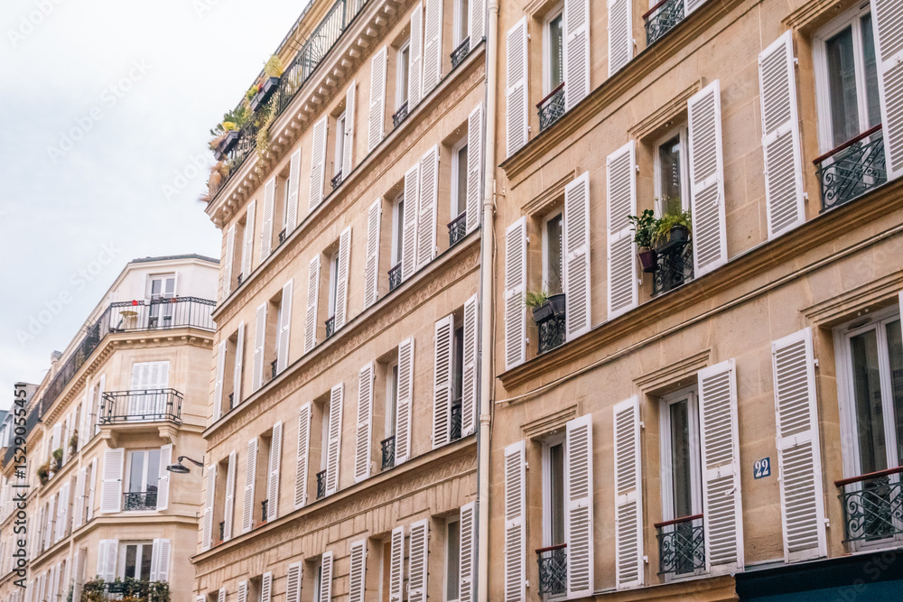 Row of Classic Parisian Apartment Buildings with White Shutters Row of Classic Parisian Apartment Buildings with White Shutters