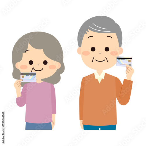マイナンバーカードを手に持つシニアの男性と女性