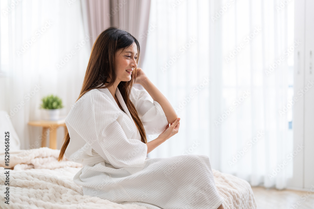 Woman applying lotion on arm for soft and hydrated skin, beauty and skincare at home, body care and moisturizing treatment cosmetics for glowing and healthy complexion, self-care and wellness Woman applying lotion on arm for soft and hydrated skin, beauty and skincare at home, body care and moisturizing treatment cosmetics for glowing and healthy complexion, self-care and wellness