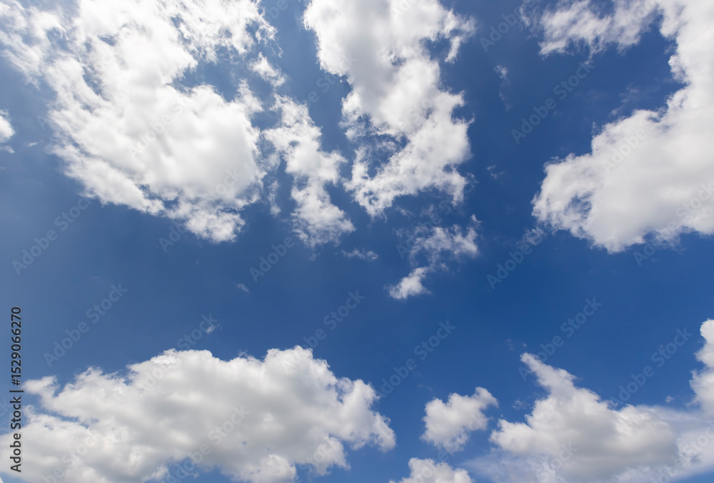 Fototapeta premium beautiful blue sky with lush white clouds in sunny bright weather