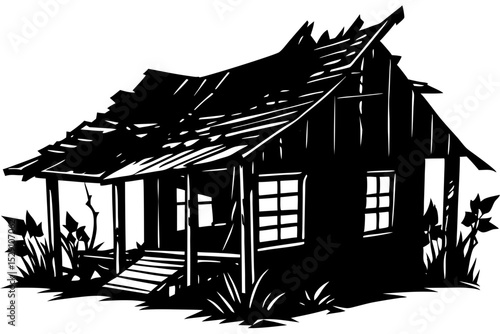 Decaying wooden shack in overgrown grass