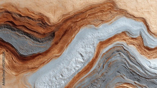 Aerial view of layered rock formations showing brown tan and gray colors.