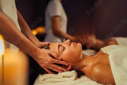 Fotografi Young couple receiving massage in spa salon - Boyfriend and girlfriend wearing t