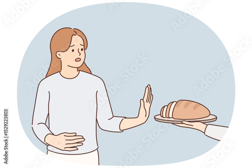 Frustrated woman holding on to stomach refuses bread due to allergies and gluten intolerance