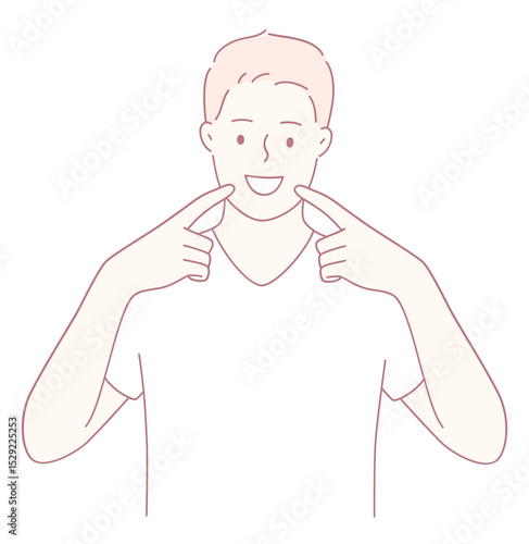A joyful young man is smiling widely and cheerfully pointing at his cheeks, showcasing his happiness and positivity