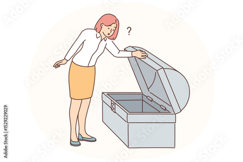 Businesswoman look in empty treasury chest
