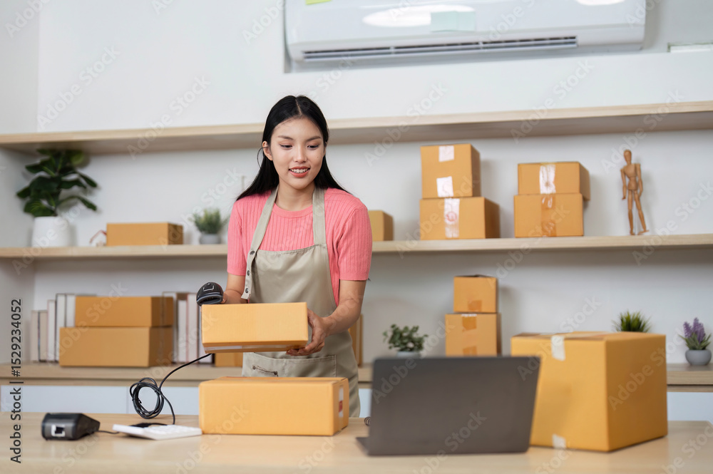 Small Business Logistics. A woman handling packages and preparing for shipment in her office. Small Business Logistics. A woman handling packages and preparing for shipment in her office.