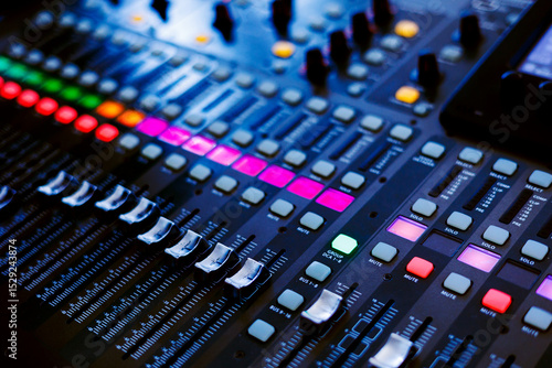 Concert sound mixer panel with volume regulators. Professional audio and light equipment for sound recording studio, live music broadcasting, television, party. mixing console. audio signals