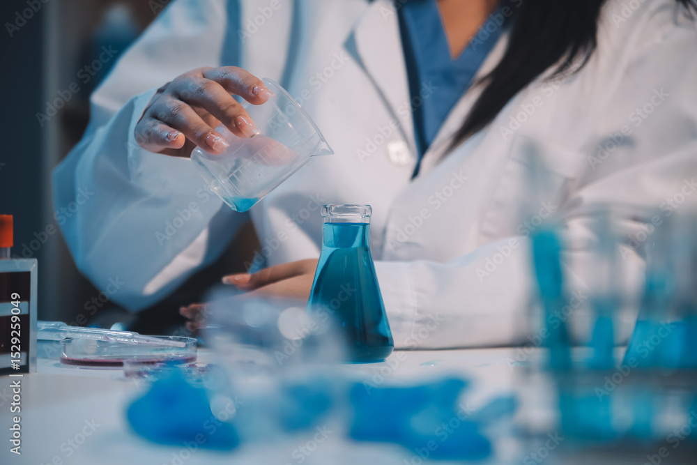 Fototapeta premium Research, experiment and medical trial being done by a scientist in a lab, science facility or hospital. One young, serious and professional researcher organizing, sorting or making a discovery