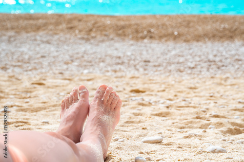 Young woman laying on a beach