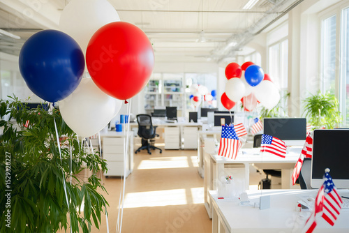 Modern office workspace decorated with red foil balloons in the shape of stars near each table, white interior, open space office, monitors on white tables. USA Independence Day, themed treats