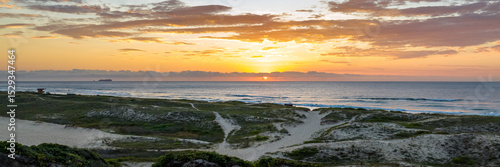 Florianópolis, Campeche beach during sunrise. Brazil. Rio Tavares neighborhood in web banner during sunrise. Aerial view in web banner.
