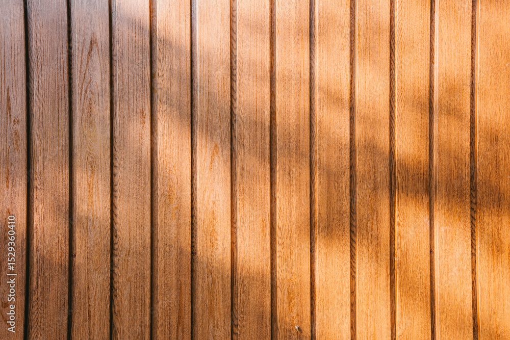 Obraz premium Wood background. Close-up Texture of Natural Wood Panels with Warm Tones and Soft Shadows Creating a Cozy Atmosphere in Interior Design