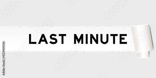 Ripped gray paper background that have word last minute under torn part