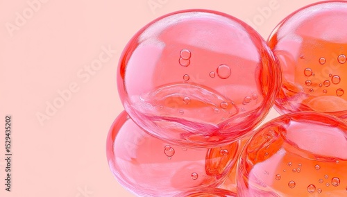 Close-up of translucent, coral-pink spheres with bubbles
