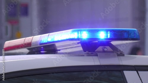 The flashing light on the roof of the car flashes red and blue in winter.