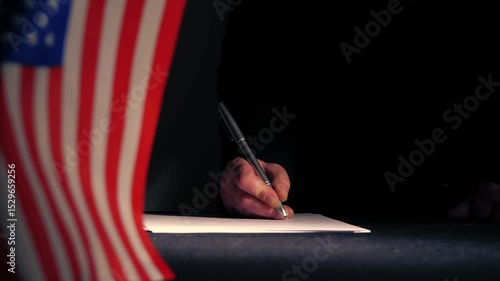 Hand signing a trade deal with American USA flag 