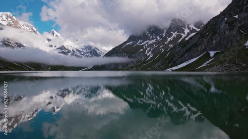 Wallpaper Mural Serene Alpine Lake Reflecting Snow-Capped Peaks and Clouds Torontodigital.ca
