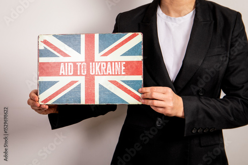 Wallpaper Mural British Support for Ukraine. Flag Sign Held by Person in Business Attire Torontodigital.ca