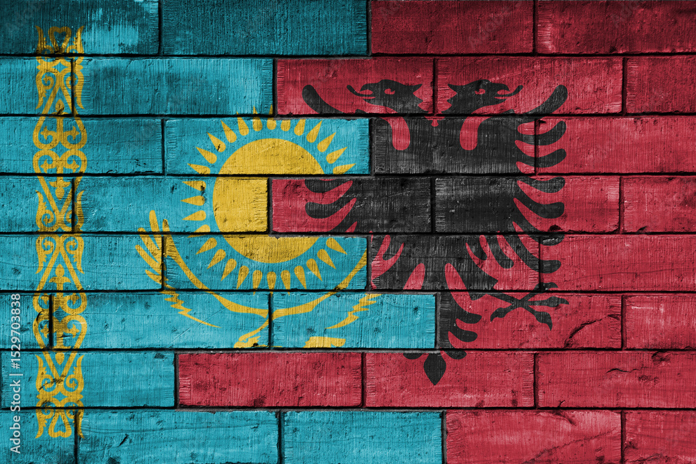 Obraz premium colourful painted big national flag of albania and flag of kazakhstan on a massive old brick wall background. concept
