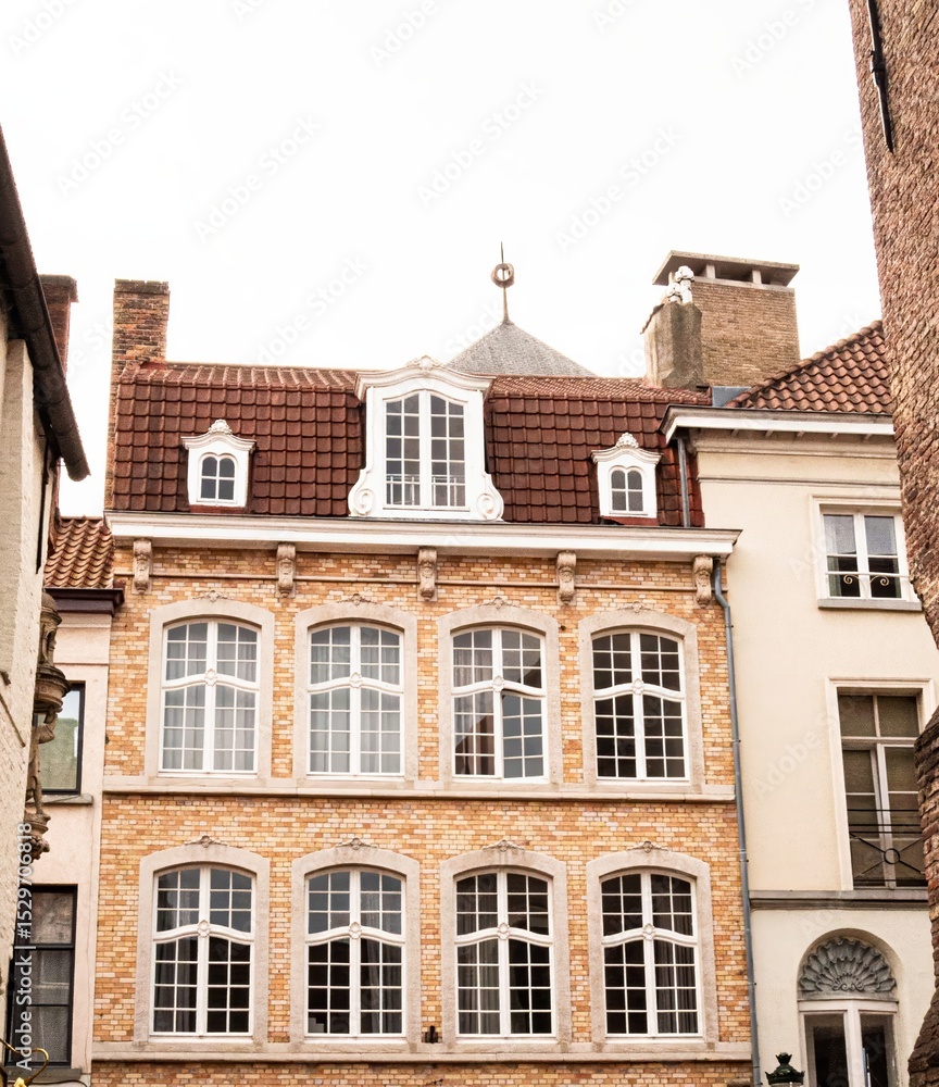 Obraz premium Old European architecture, Belgium Bruges houses with dormer windows – perfect for European city real estate ads, summer city tour
