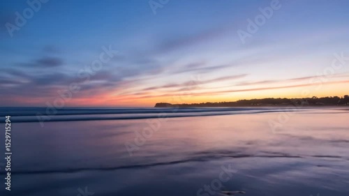 Wallpaper Mural Serene beach sunrise with pastel sky and smooth waves seamless looping 4k time-lapse animation video background Torontodigital.ca