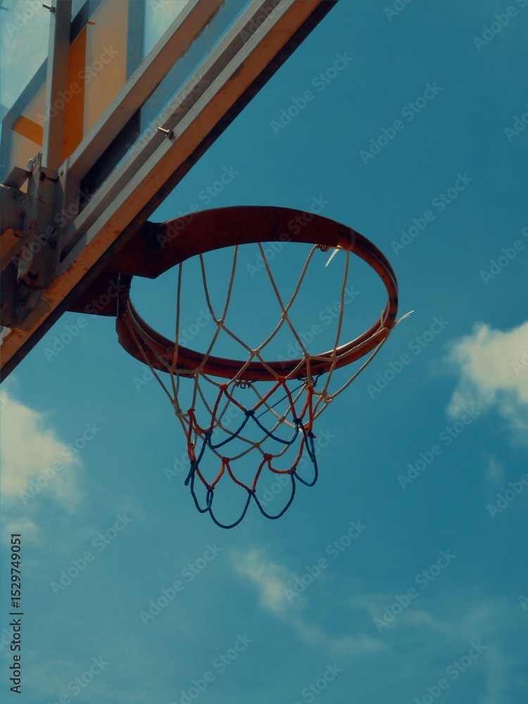 basketball hoop against blue sky basketball hoop against blue sky