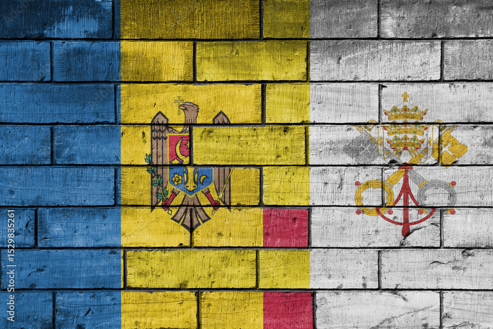 Obraz premium colourful painted big national flag of vatican city and flag of moldova on a massive old brick wall background. concept