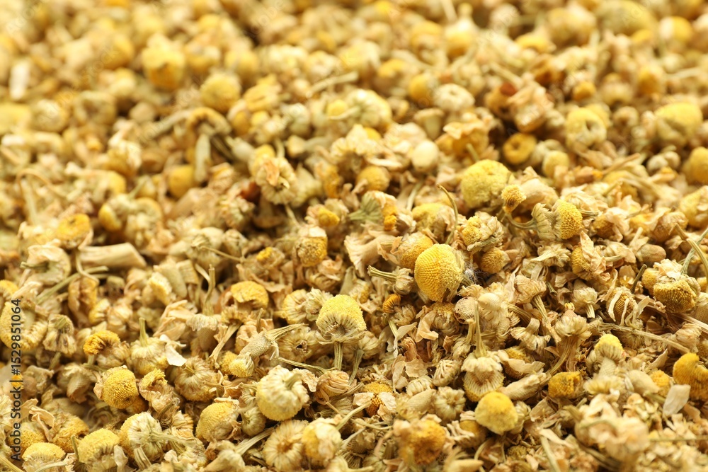 Dry chamomile flowers as background, closeup view Dry chamomile flowers as background, closeup view
