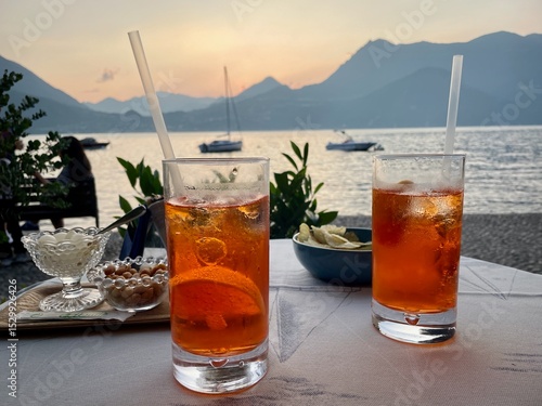 Aperitivo at sunset in Varenna, Lake Como, Italy, Aperol Spritz cocktails.