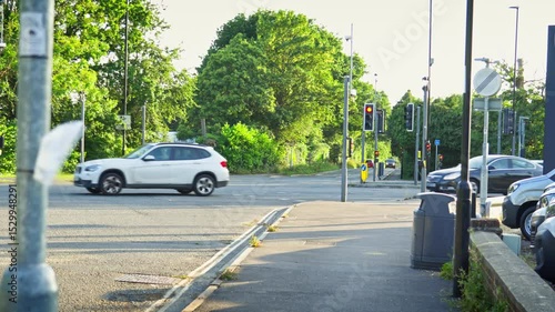 Busy Road Junction With Cars Driving past From Side To Side