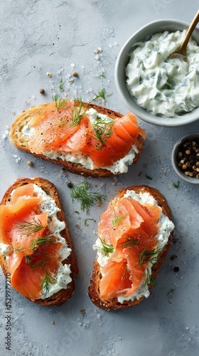 Bread Topped With Cream Cheese and Smoked Salmon Garnished With Black Pepper.