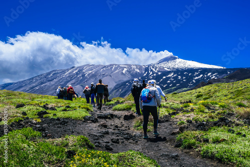 Hikers on Mount Etna Against a Dramatic Landscape