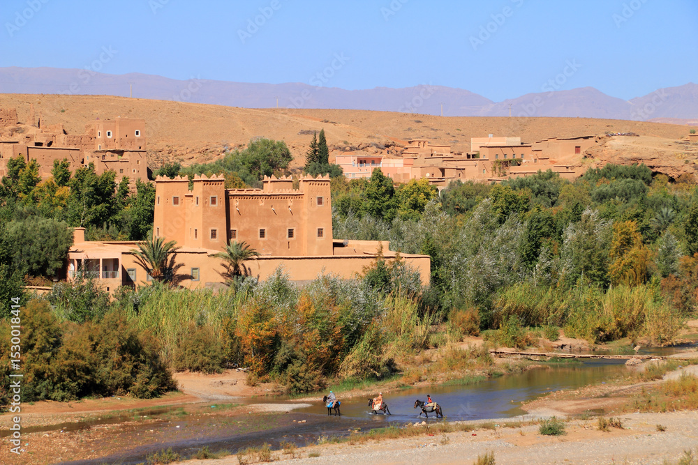 Morocco, The Dades Valley also known as Valley of the Roses - Restored Kasbah overlooking the Dades River. Morocco, The Dades Valley also known as Valley of the Roses - Restored Kasbah overlooking the Dades River.