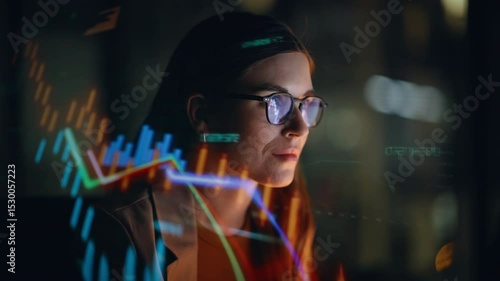 Stock market trader working hologram night closeup. Diagrams projected on face