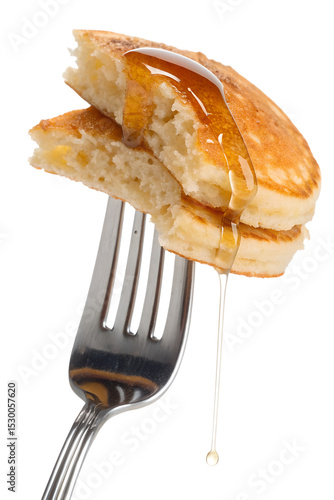 Pancakes with syrup on fork isolated on transparent background, breakfast food close-up, dripping maple syrup