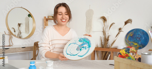 Young woman creating fluid ...