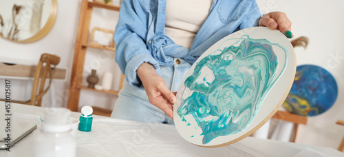 Young woman creating fluid ...