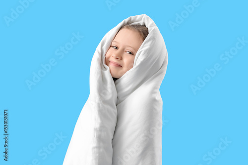 Little girl wrapped in blan...