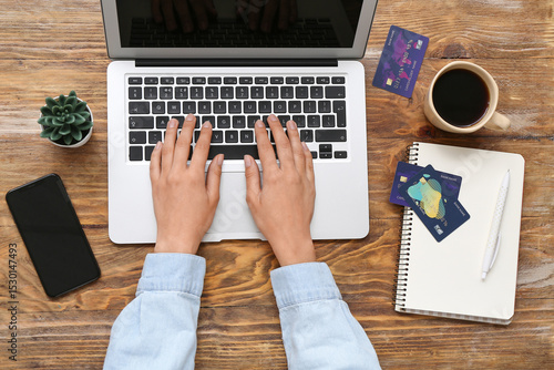 Woman with laptop and credi...