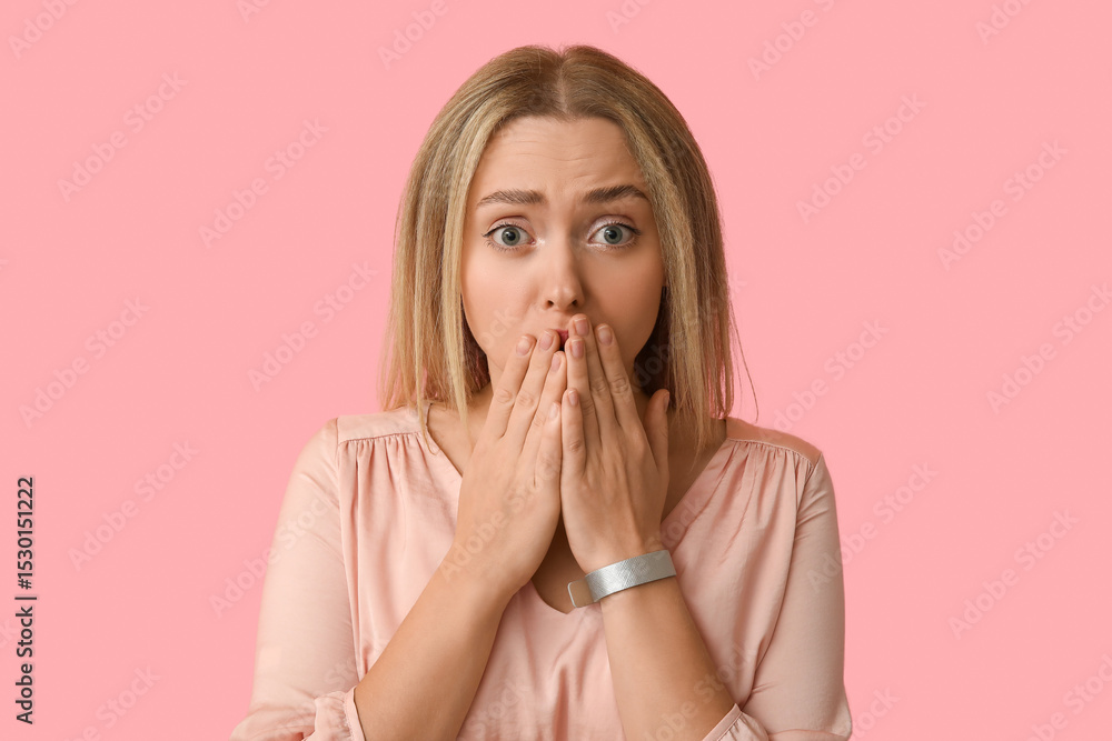 Embarrassed young woman on pink background Embarrassed young woman on pink background