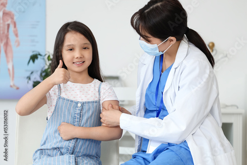 Female doctor applying medi...