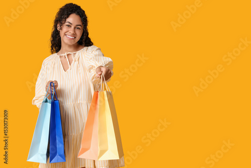 Happy young woman holding c...