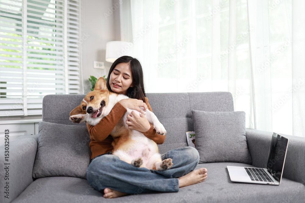 A cheerful young woman works from home, smiling warmly as her cute labrador sits beside her, bringing comfort, companionship, and joy. A cheerful young woman works from home, smiling warmly as her cute labrador sits beside her, bringing comfort, companionship, and joy.