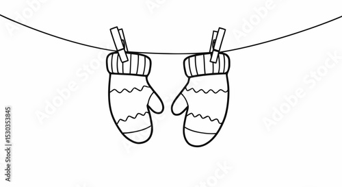 Winter mittens hanging on clothesline