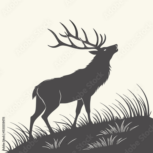 Majestic Elk Silhouette Standing Proudly in a Grassy Field on a Hill