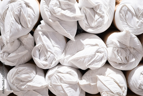 Wallpaper Mural Pillows rolled up and arranged in rows Torontodigital.ca